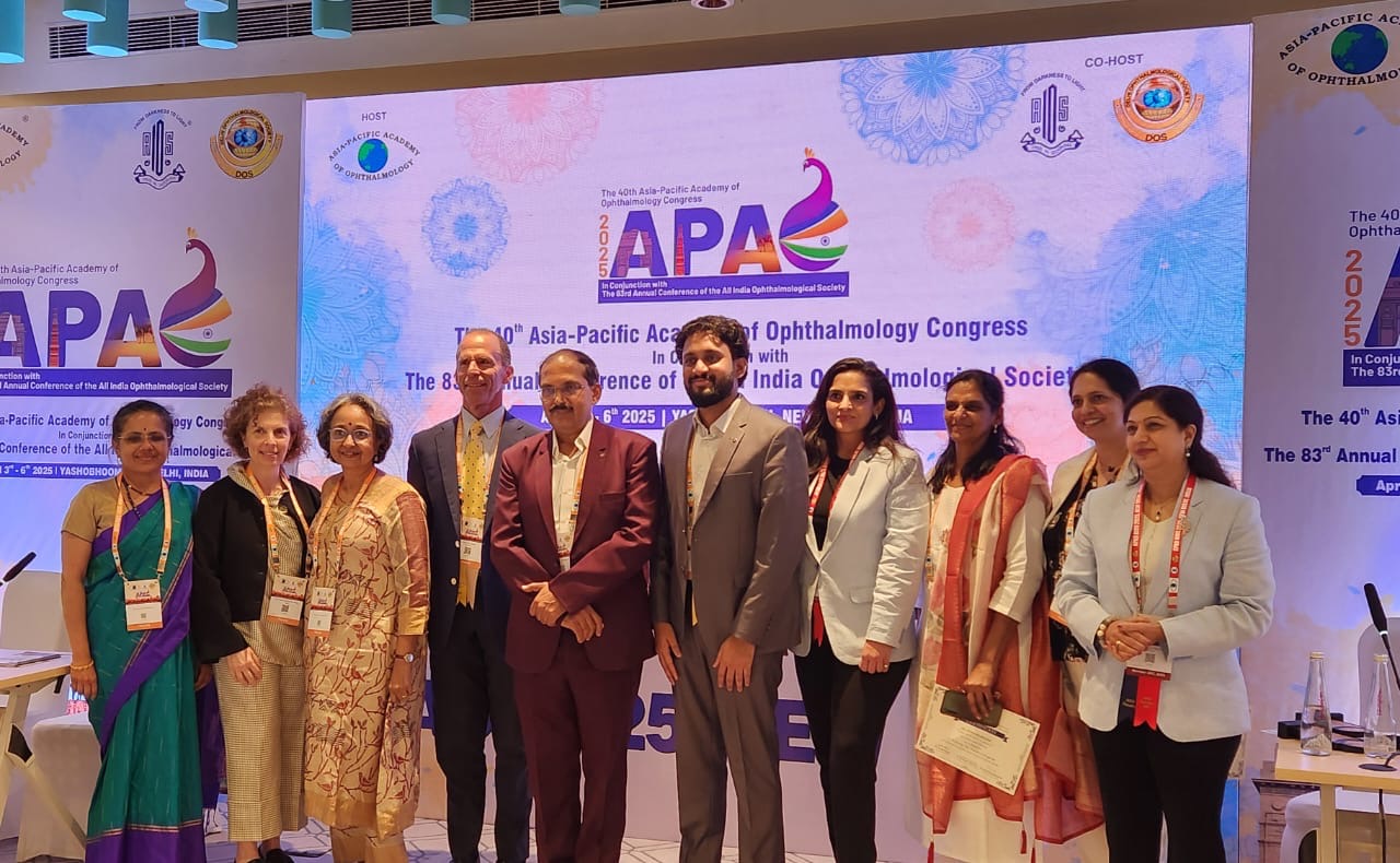Group of people in 7 rows in India with conference badges