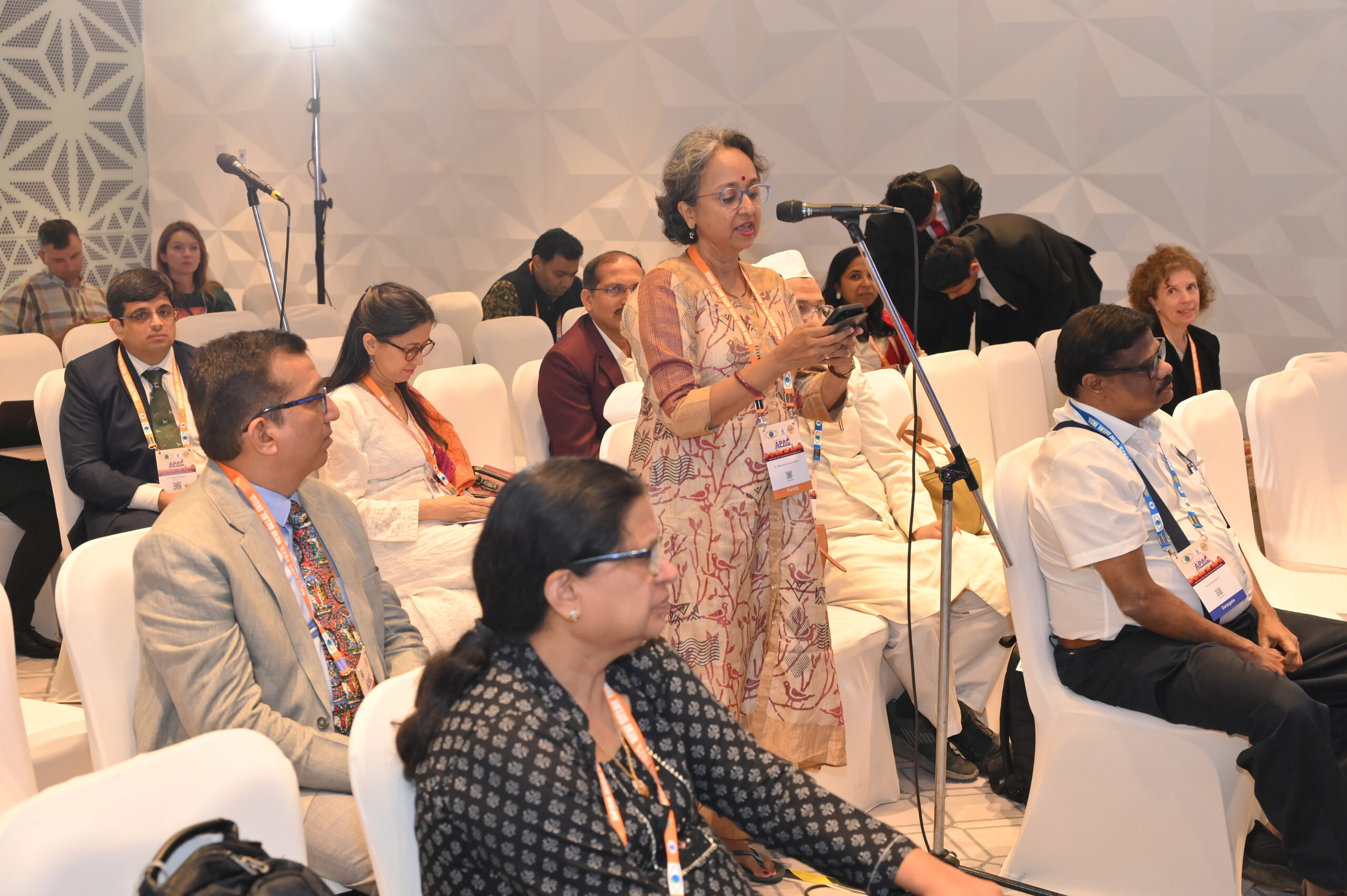 Group of people in 7 rows in India with conference badges