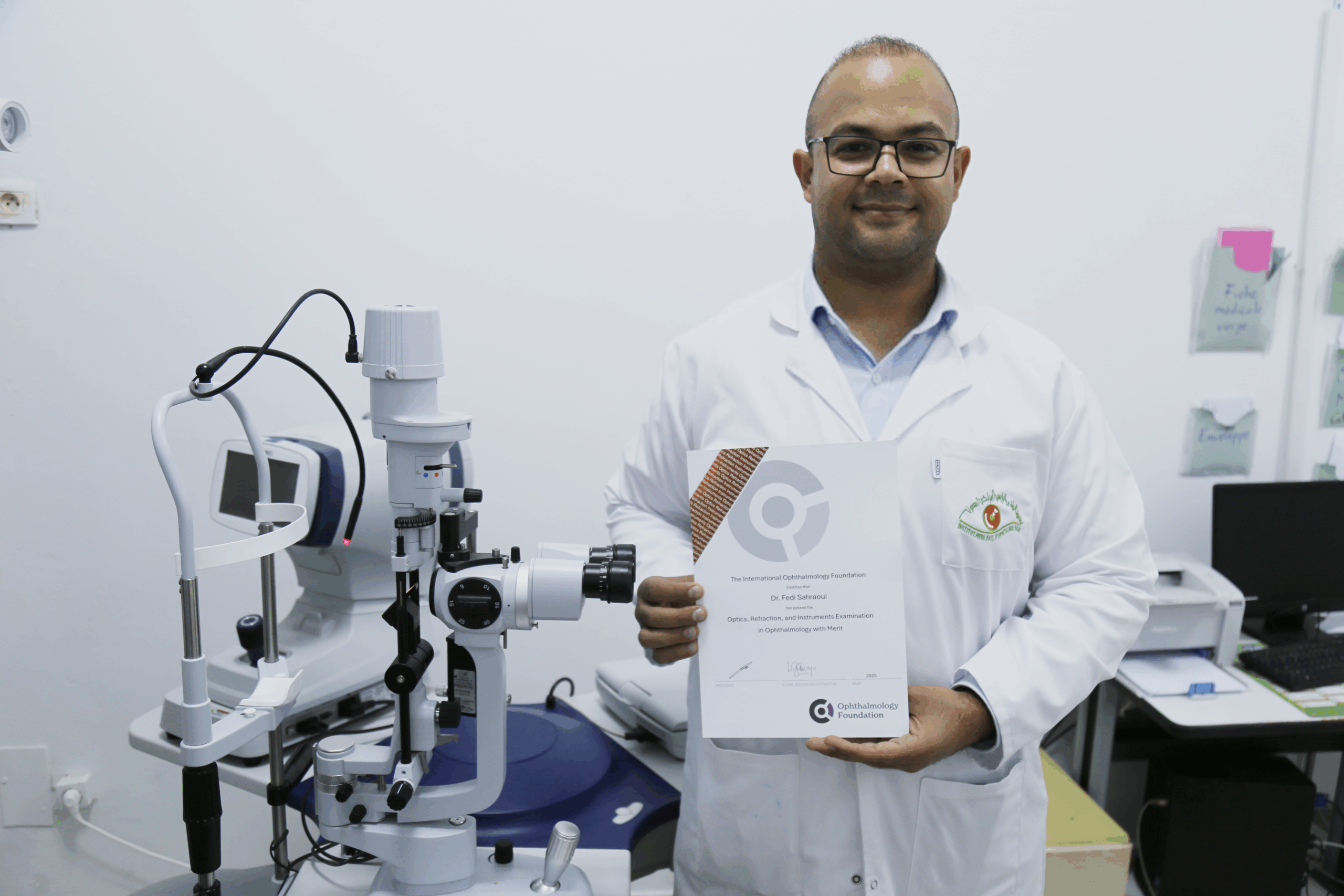 Four professionals wearing badges in front of a screen at a conference