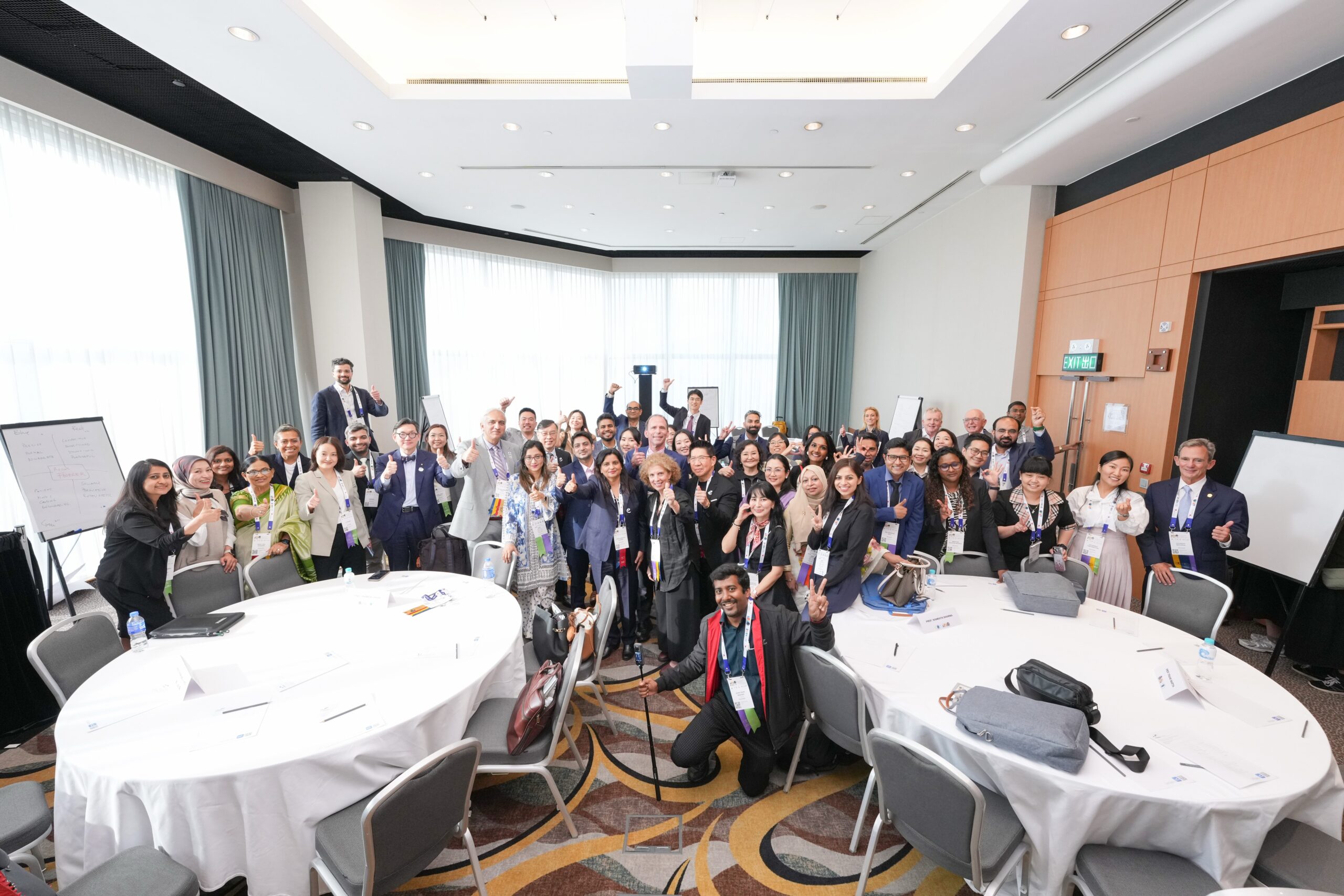 Group of people in 7 rows in India with conference badges