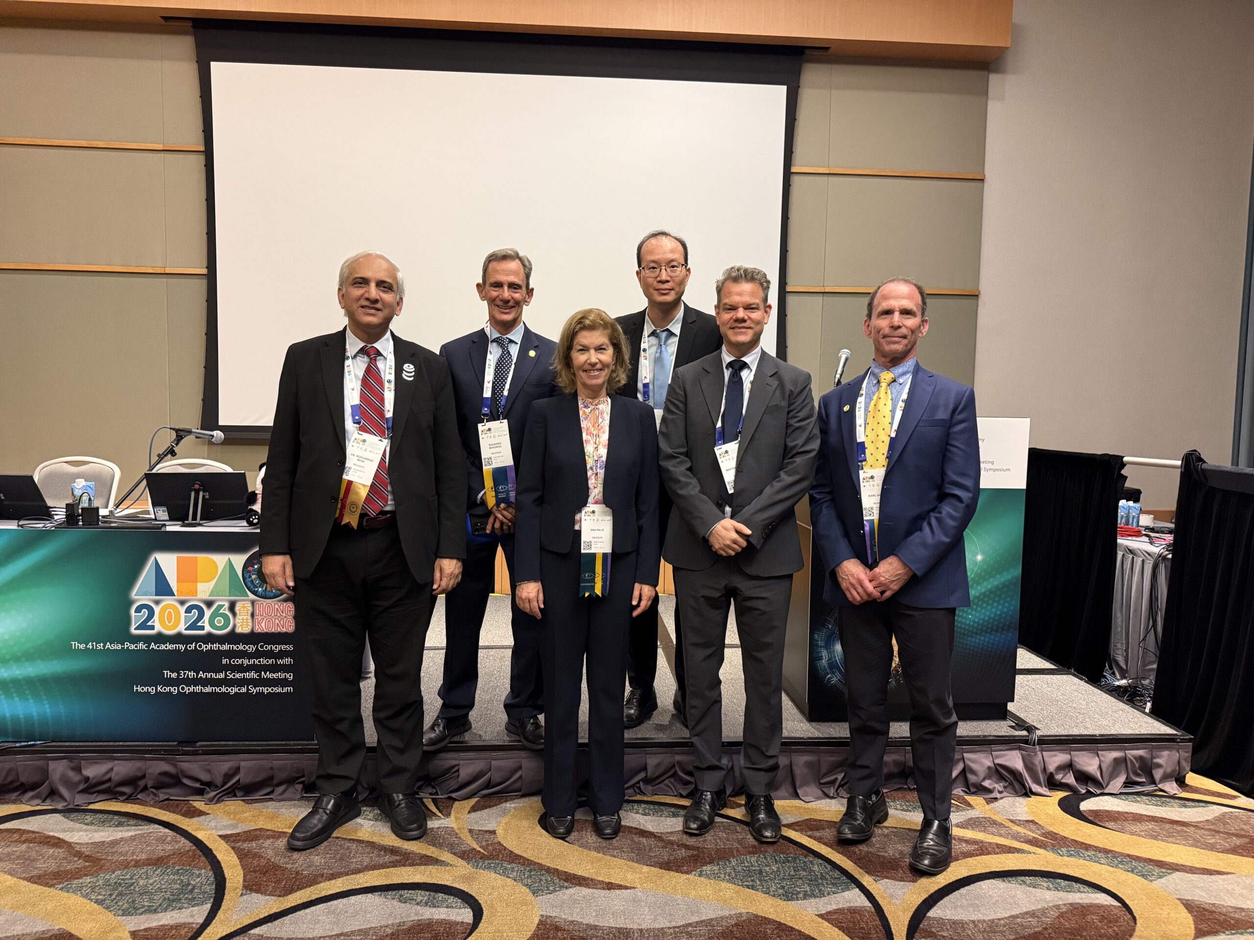 Group of people in 7 rows in India with conference badges