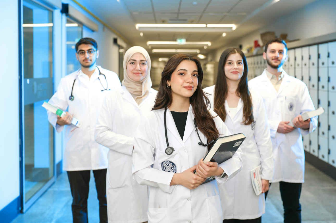 Five doctors in Egypt standing in a hallway